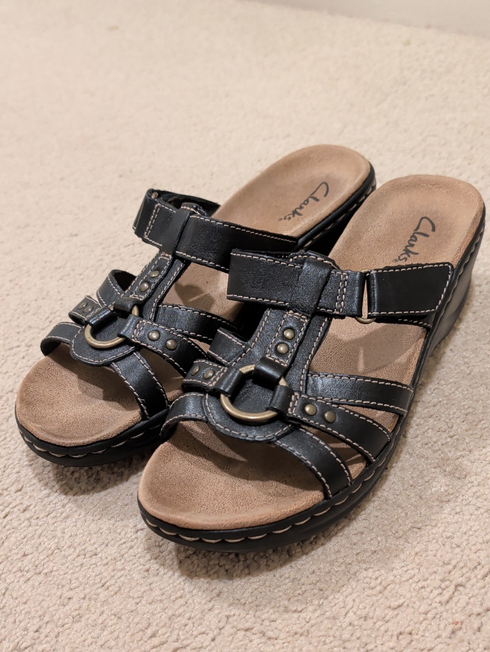 Clarks Black Leather Slide Mules with Metallic Ring Detail